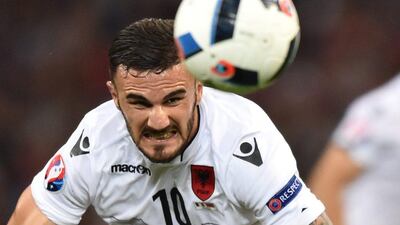 Albania right-back Armando Sakidu heads the ball. Bertrand Langlois / AFP
