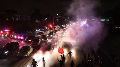 Protesters march along Interstate 580 in Oakland, California on Saturday. Protesters marched in Oakland to decry racism in the wake of deadly violence that erupted at a white nationalist demonstration in Virginia. Noah Berger / AP.