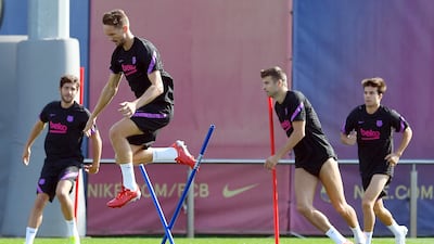 Barcelona forward Luuk de Jong jumps during training. AFP