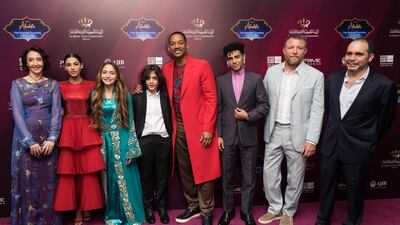 From left: Princess Rym Ali, Naomi Scott, Princess Jalila, Prince Abdullah, Will Smith, Mena Massoud, director Guy Ritchie and Prince Ali bin Hussein at a VIP Screening of ‘Aladdin’ in Jordan earlier this month; below left, Massoud and Smith as the Genie and Aladdin Getty; Disney