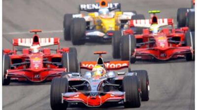 The Ferraris of Felipe Massa, right, and Kimi Raikkonen, left, were left trailing by the McLaren of race winner Lewis Hamilton.