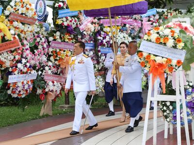 Thailand's King Maha Vajiralongkorn and Queen Suthida arrive at the Siriraj Hospital in Bangkok, Thailand, September 24. AP