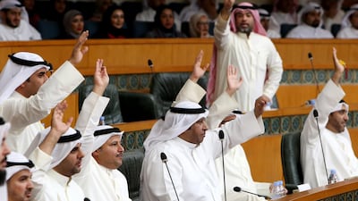 Kuwaiti MPs react during a parliament session at Kuwait's National Assembly in Kuwait City on March 6, 2018. AFP