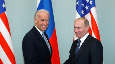 Washington and the Kremlin are in discussions about a first presidential summit between Joe Biden and Vladimir Putin, pictured in a 2011 file photo when Mr Biden was US vice president and Mr Putin Russia's prime minister. AP