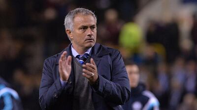 Jose Mourinho applauds after Chelsea's win over Burnley on Monday night in their Premier League season opening match. Paul Ellis / AFP / August 18, 2014