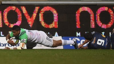 Waisake Naholo, left, of the Highlanders scores a try despiteduring the quarter-final Super Rugby match against the ACT Brumbies at GIO Stadium in Canberra, Australia, July, 22, 2016. Dean Lewis / EPA