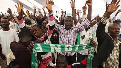 Nigerian fans celebrate after watching Kalu Uche score a goal against Greece, on a screen in a World Cup fan park in Lagos, Nigeria yesterday. The Nigerians also had plenty of support from fellow Africans in fan parks in South Africa as they went down 2-1 in their Group B clash.