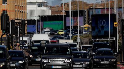 Cars queue in traffic on the main A4 road in London. AP
