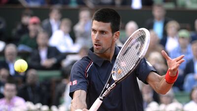 2012 French Open semi-finals: Djokovic advanced to his first French Open final with a straight-sets victory over Federer to even up their clay-court record to 3-3. He would lose to Nadal in the final. AFP