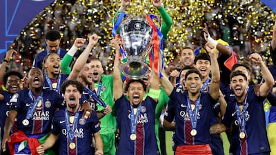 Marquinhos of Paris Saint-Germain lifts the Uefa Champions League trophy after his team's victory over Arsenal in the final at Puskas Arena in Budapest. Getty Images