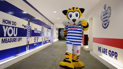 Spark, the QPR club mascot walks out of the tunnel ahead of the club's Premier League match against Burnley on Saturday. Jamie McDonald / Getty Images