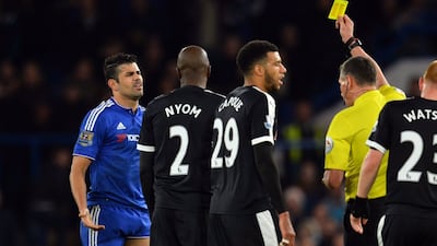 Chelsea's Diego Costa reacts as he is given a yellow card on Saturday in his team's Premier League match against Watford. Glyn Kirk / AFP / December 26, 2015