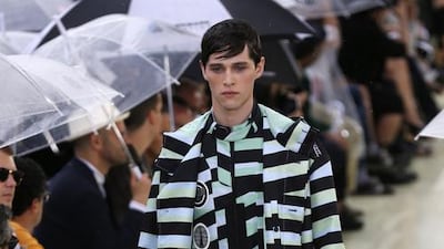 A model presents a creation by Kenzo during the men's 2015 spring-summer collection fashion show on June 28, 2014 in Paris. AFP