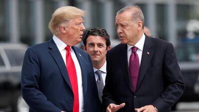 Donald Trump and Recep Tayyip Erdogan gesture as they talk at the start of the Nato Summit in Brussels in July. Reuters