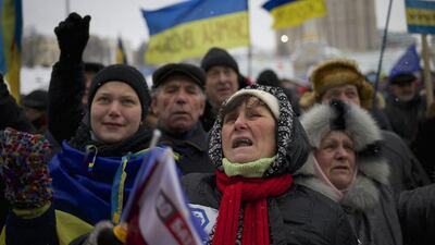 Some of the thousands of protesters who want Ukraine to align itself with the European Union and not Russia, as the country’s president proposes, make sure their views are heard at a rally in Kiev. Alexander Zemlianichenko / AP Photo