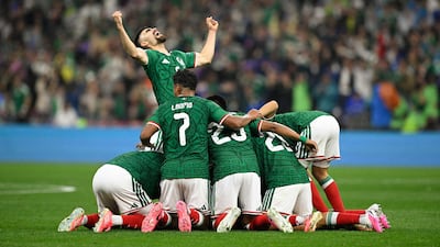 Mexico players celebrate after forward Raul Jimenez scores his team’s second goal against Ecuador in Mexico City. AFP