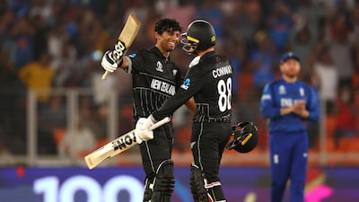 New Zealand's Rachin Ravindra celebrates with Devon Conway after reaching his century against England. Reuters