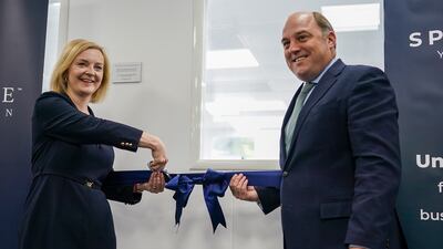 Then Conservative leadership hopeful Liz Truss and Mr Wallace visit an engineering company in Huddersfield ahead of a hustings event in August. Getty Images