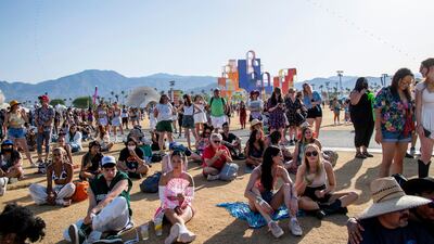 Festivalgoers attend Coachella in Indio, California. Invision / AP