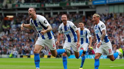 Brighton's Shane Duffy, left, celebrates scoring the second goal with teammates. Reuters