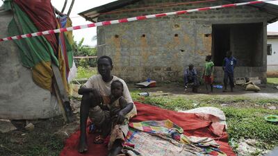 A suspected Ebola carrier sits in isolation in Liberia. Photo: James Giahyue / Reuters