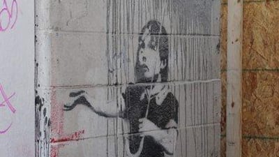 A mural by the artist Banksy, in New Orleans. Neighbors stopped what police say was an apparent attempt to steal a chunk of cinderblock wall bearing a painting created after Hurricane Katrina by the elusive British graffiti artist Banksy. AP