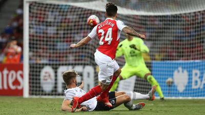 Hector Bellerin of Arsenal attempts on goal during the Asia Trophy final against Everton at Singapore's National Stadium on Saturday. Lionel Ng / Getty Images