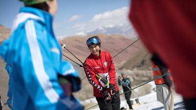 A young female competitors prepares to take the rope tow up to the top of the mountain for her run. Rick Findler for The National
