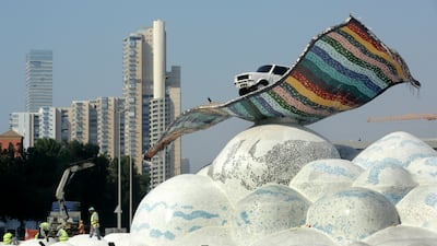 A road crew works in Flying Carpet Square, outside the Formula One corniche circuit, in Jiddah, Saudi Arabia. The F1 race, which will take place from Dec. 3-5, will be the first time Saudi Arabia hosts the premier sporting event. AP Photo