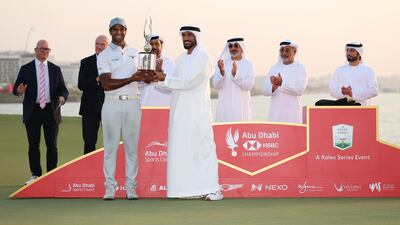 Aaron Rai of England is presented with the Falcon Trophy after winning the Abu Dhabi HSBC Championship. Getty Images