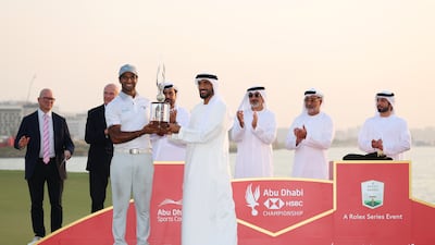 Aaron Rai of England is presented with the Falcon Trophy after winning the Abu Dhabi HSBC Championship. Getty Images