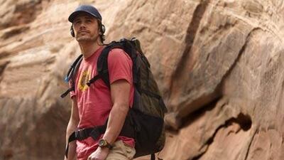 James Franco stars as the real-life climber Aron Ralston, who became trapped under a boulder in 2003, in the drama 127 Hours.