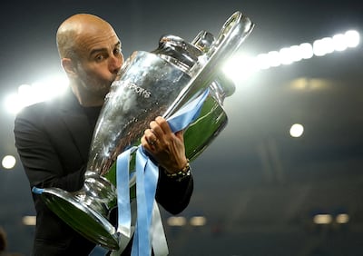 Pep Guardiola kisses the Champions League trophy after City's 1-0 win over Inter Milan in the 2023 final in Istanbul. Reuters