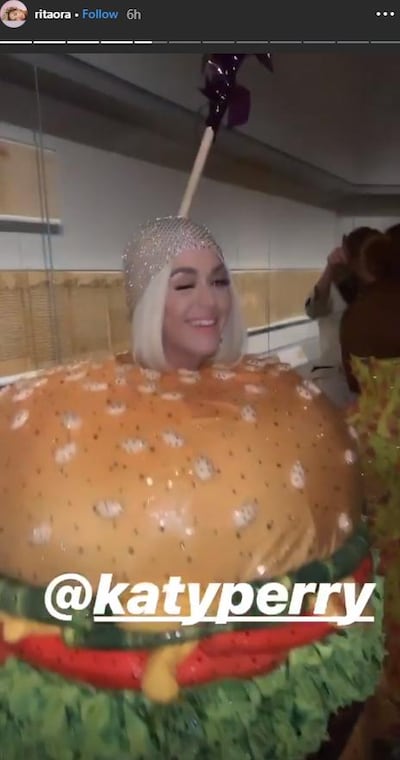 Katy Perry changed into a Moschino burger suit later in the night. Instagram / Rita Ora