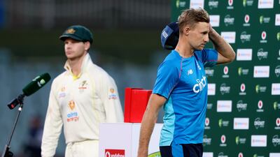 England's captain Joe Root, right, walks off as his counterpart Steve Smith takes the stage. AP