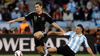 Miroslav Klose, left, scored two goals in Germany's comprehensive victory over Argentina.