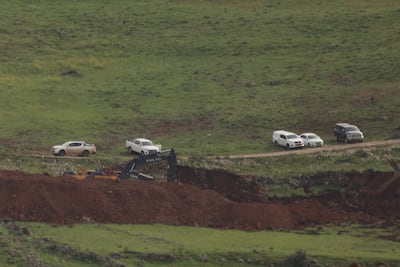 Earthmoving machinery creates trenches alog the Sufa 53 line in Syria's Quneitra province. Anadolu via AFP
