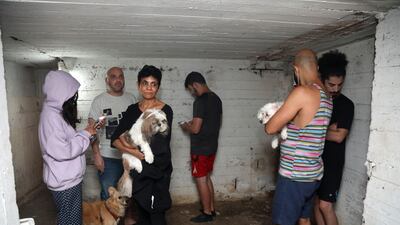 People take shelter in the basement of a building in the Israeli city of Tel Aviv as alarm sirens wailed after 3:00 a.m. after rockets were launched towards Israel from the Gaza Strip. AFP