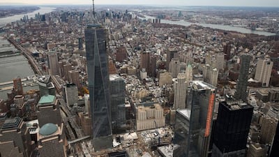 One World Trade Center, deemed the tallest building in North America, towers over lower Manhattan. Andrew Burton / Getty Images via AFP