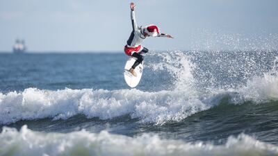 All this surfer wanted for Christmas was a tasty wave. Reuters