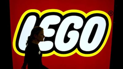 The Lego logo at the toy fair in Nuremberg. The family-owned group said its net earnings fell as it was unable to keep up with demand. Daniel Karmann / EPA