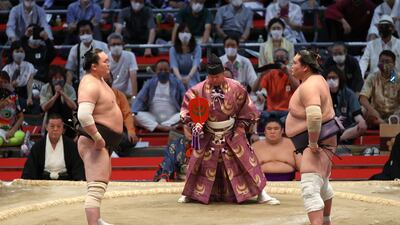 Sumo wrestlers Hakuho, left, and Terunofuji before their fight at the Grand Sumo Tournament in Nagoya, Aichi Prefecture. AFP