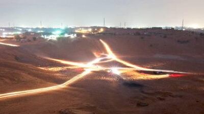 A twenty-five second exposure captures the light trails of those drivers climbing the dunes as part of the Awafi Festival in Ras al Khaimah. The tournament ends on January 7.