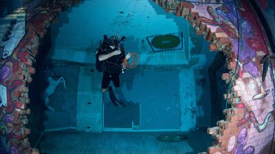 Royal Navy ship divers try out the new Deep Dive Dubai pool.