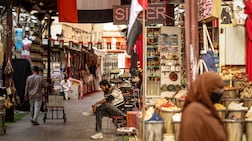 Shopkeepers and customers in Dubai's Old Souk. AFP