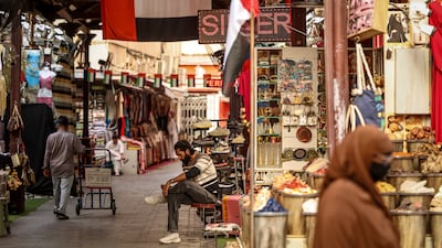 Shopkeepers and customers in Dubai's Old Souk. AFP
