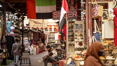 Shopkeepers and customers in Dubai's Old Souk. AFP