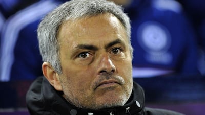 Jose Mourinho and Chelsea are two points ahead of Arsenal at the top of the Premier League. Paul Ellis / AFP