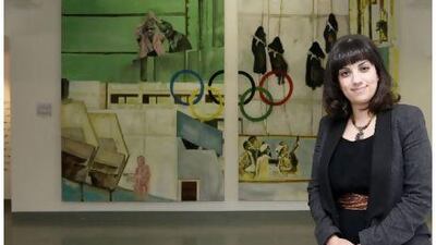 Mandy Merzaban, Barjeel's gallery manager, said it was vital to find the right work to fit the right show. Behind her is Munich Glamour, Jeffar Khaldi's interpretation of the terrorist attacks on the Munich Olympics.