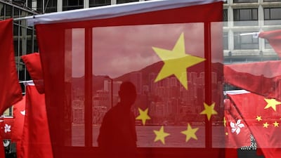 China and Kong Hong national flags displayed outside a shopping centre in Hong Kong on June 28, 2017 to mark the 20th anniversary of Hong Kong handover to China. Hong Kong is planning a big party as it marks 20 years under Chinese rule. Kin Cheung/AP Photo